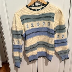 Elegant Striped Sweater with Floral Accents